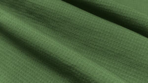 Detalhe do tecido Grafiato da Diklatex em verde, com tecnologia Dry para gerenciamento de umidade.