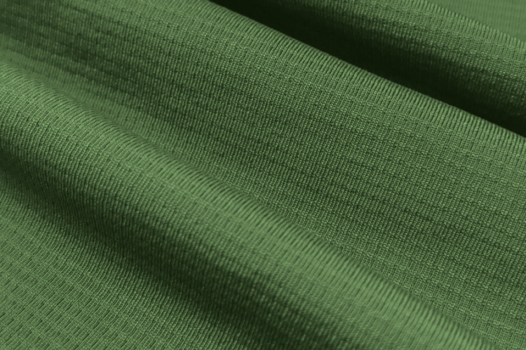Detalhe do tecido Grafiato da Diklatex em verde, com tecnologia Dry para gerenciamento de umidade.