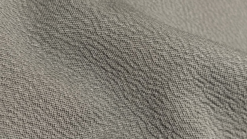 Tecido respirável Eco Unique do Casual Tech® em detalhe, destacando a textura e a construção da malha.